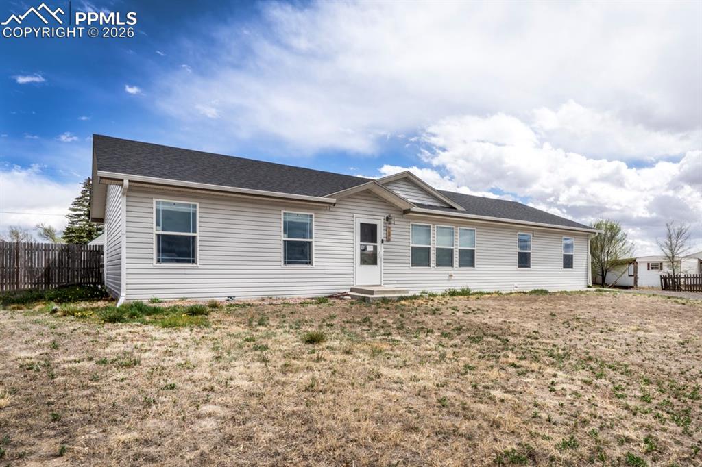 736 Indiana Avenue Limon, CO 80828 - Photo 3 of 37 a house with trees in front of it