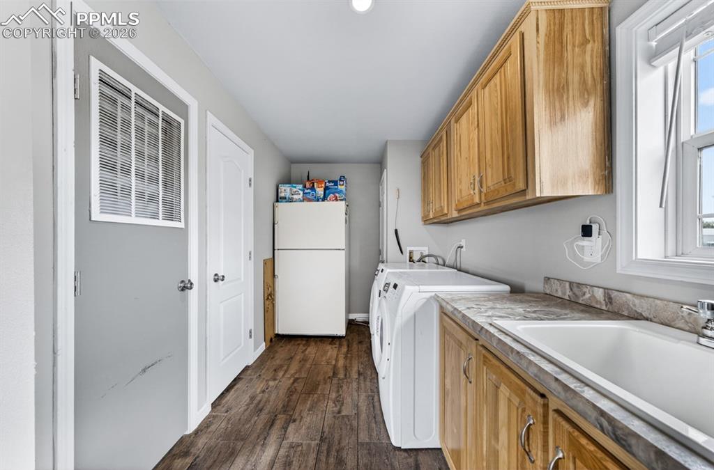 736 Indiana Avenue Limon, CO 80828 - Photo 31 of 37 a utility room with dryer and washer