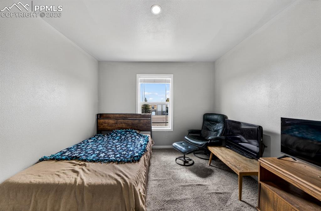 736 Indiana Avenue Limon, CO 80828 - Photo 32 of 37 a bedroom with a bed and a couch