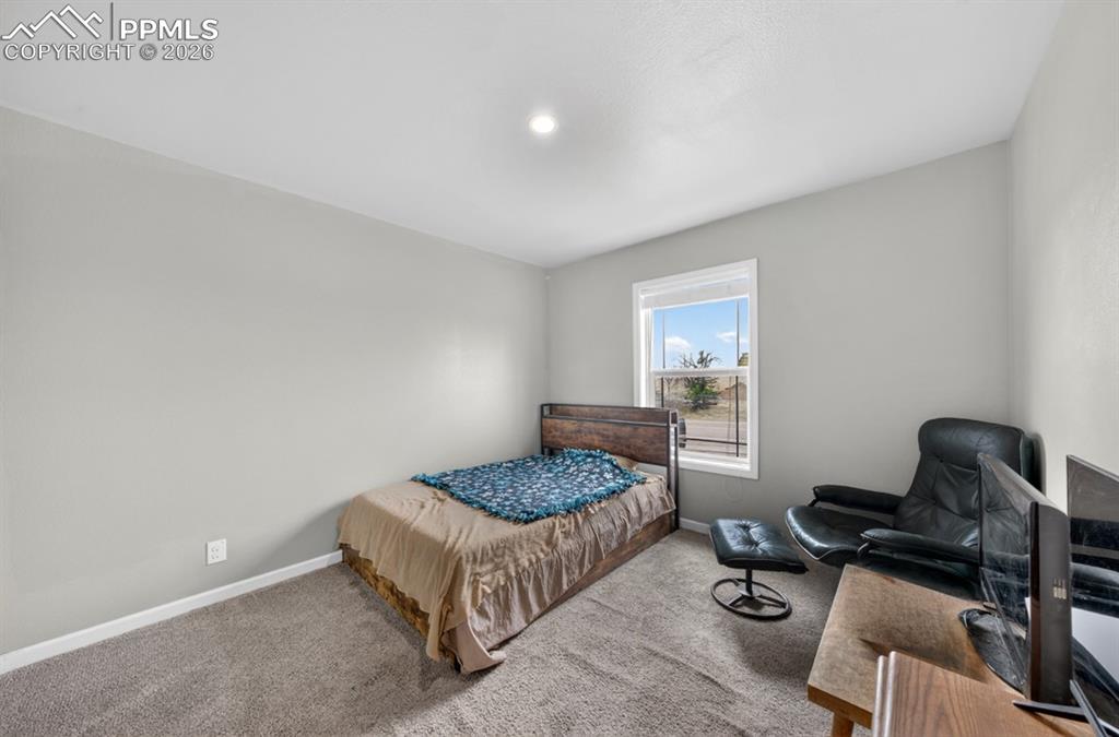 736 Indiana Avenue Limon, CO 80828 - Photo 33 of 37 a bedroom with a bed and chair