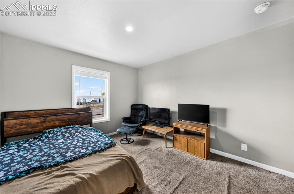 736 Indiana Avenue Limon, CO 80828 - Photo 34 of 37 a bedroom with a bed and a window