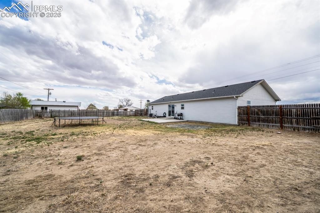 736 Indiana Avenue Limon, CO 80828 - Photo 36 of 37 a house view with swimming pool in front of it