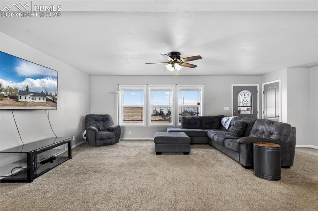 736 Indiana Avenue Limon, CO 80828 - Photo 4 of 37 a living room with furniture and a window
