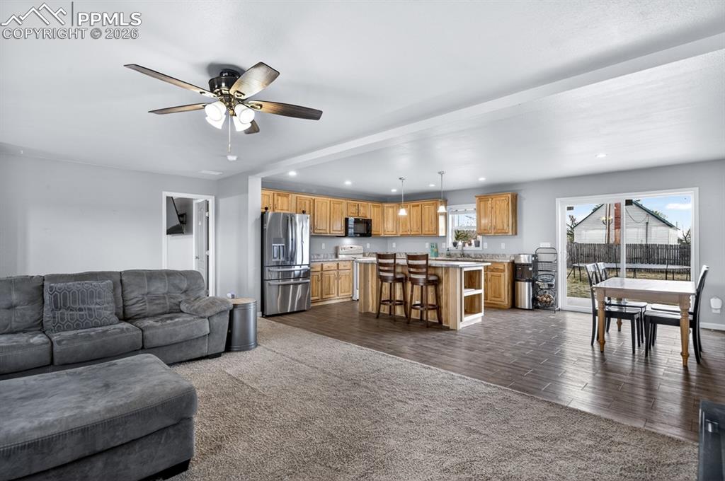 736 Indiana Avenue Limon, CO 80828 - Photo 5 of 37 a living room with furniture and kitchen view