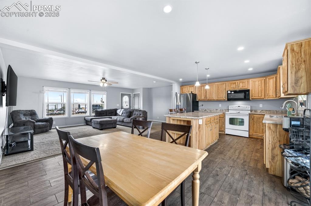 736 Indiana Avenue Limon, CO 80828 - Photo 9 of 37 a large kitchen with a table and chairs