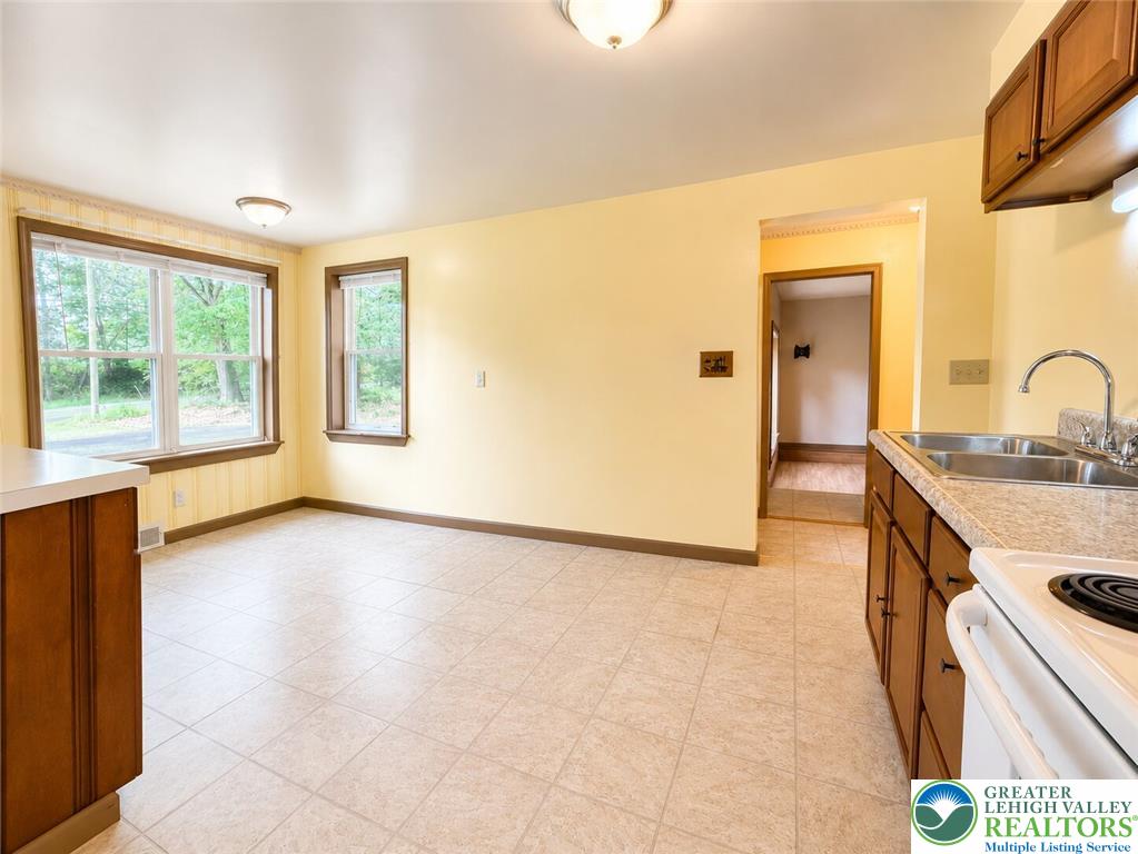 4995 Mountain Road Slatington, PA 18080 - Photo 9 of 30 A well-lit kitchen with ample counter space and natural illumination from two windows.