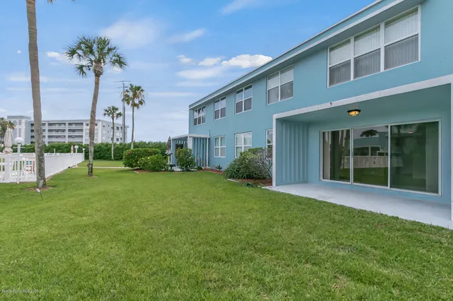 a kitchen with a sink a stove and cabinets