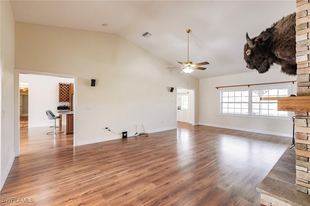 27425 Jones Loop Road Punta Gorda, FL 33982 - Photo 12 of 46 a view of a room with wooden floor