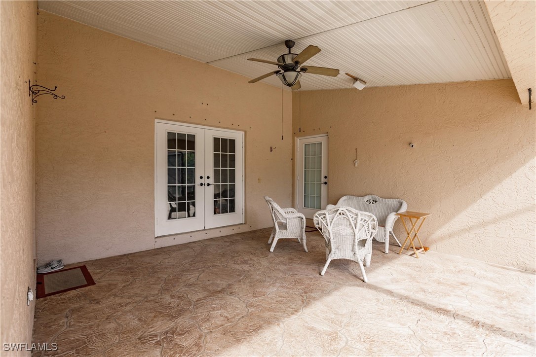 27425 Jones Loop Road Punta Gorda, FL 33982 - Photo 44 of 46 a living room with furniture and a window