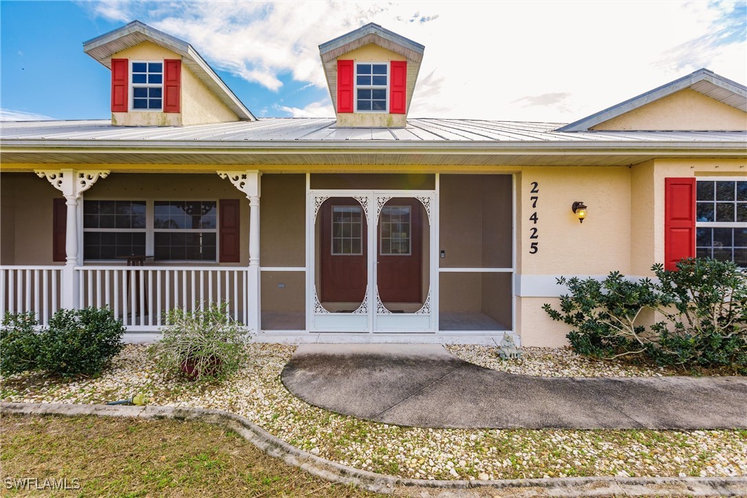 27425 Jones Loop Road Punta Gorda, FL 33982 - Photo 5 of 46 a front view of a house