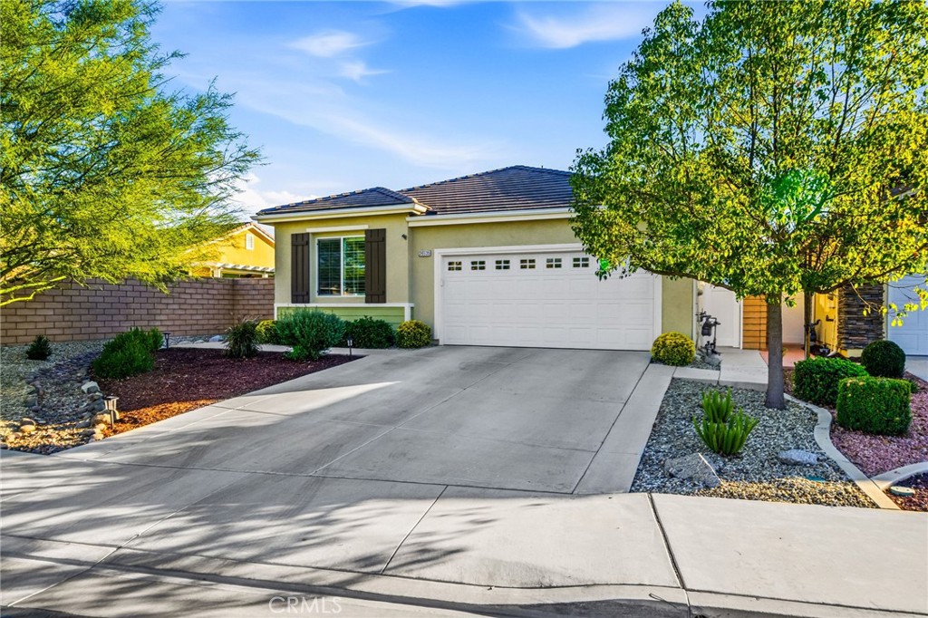 26535 Rim Creek Path Menifee, CA 92584 - Photo 2 of 50 a front view of a house with a yard and garage