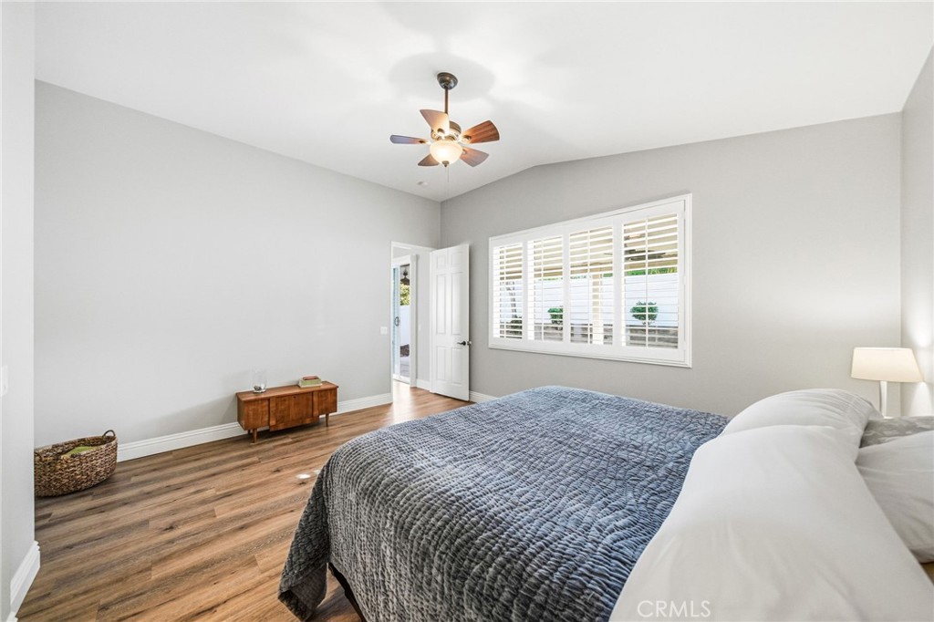 26535 Rim Creek Path Menifee, CA 92584 - Photo 23 of 50 a bedroom with a bed and a window