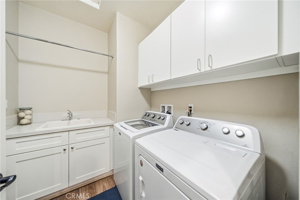 26535 Rim Creek Path Menifee, CA 92584 - Photo 30 of 50 a utility room with dryer and washer