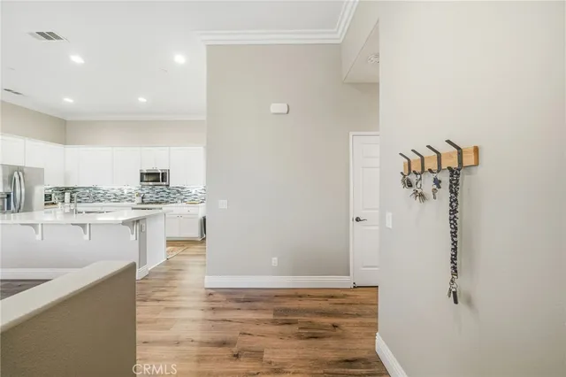 a view of a kitchen cabinets and wooden floor