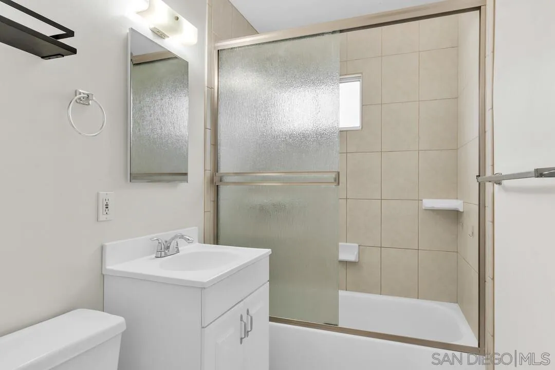 9540 Abbeyfield Road Santee, CA 92071 - Photo 18 of 35 a bathroom with a sink a toilet and shower