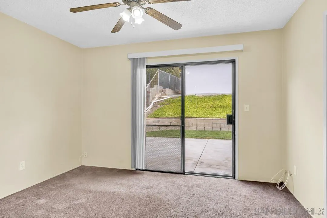 9540 Abbeyfield Road Santee, CA 92071 - Photo 20 of 35 an empty room with sliding door