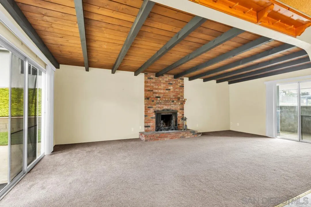 9540 Abbeyfield Road Santee, CA 92071 - Photo 5 of 35 a view of a livingroom with an empty space and a fireplace