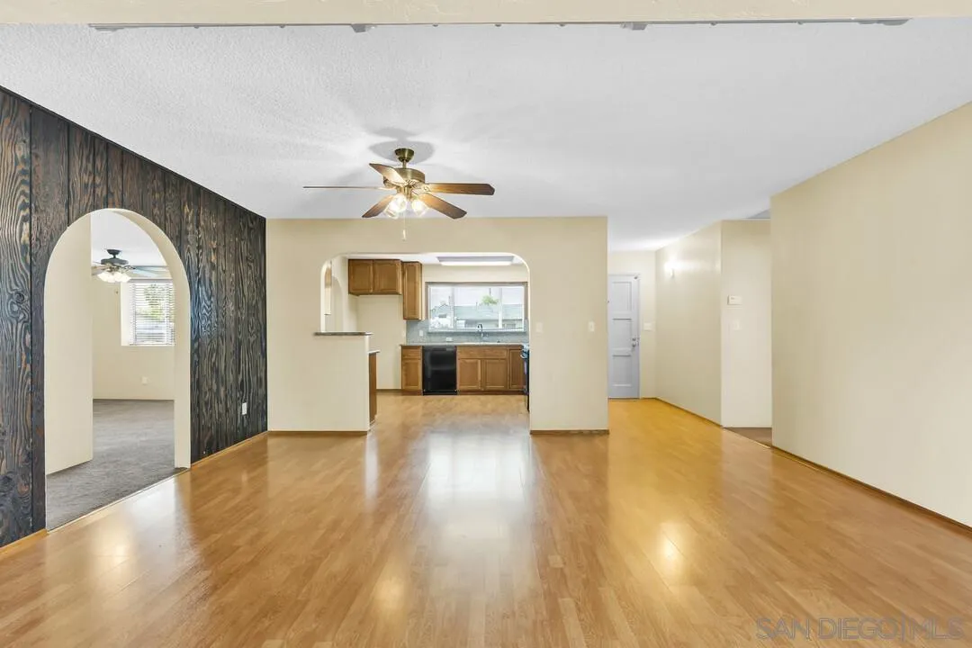 9540 Abbeyfield Road Santee, CA 92071 - Photo 8 of 35 a view of an empty room with window and wooden floor