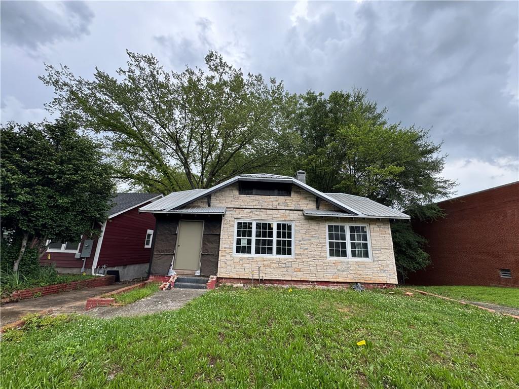 a front view of a house with yard