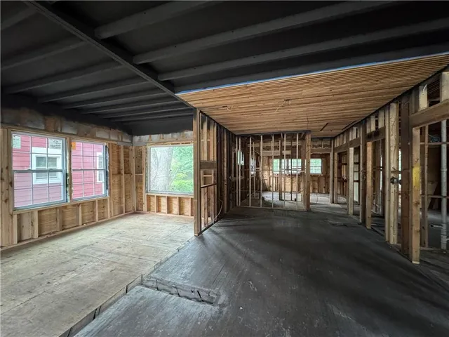 a view of an empty room with a fireplace