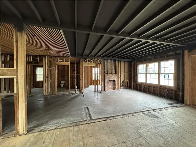 a view of an empty room with entrance door
