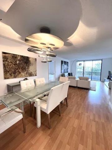 a living room with a table or chairs and a wooden floor