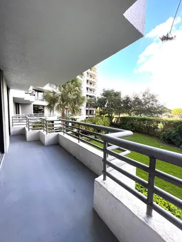 a view of city from balcony with seating space