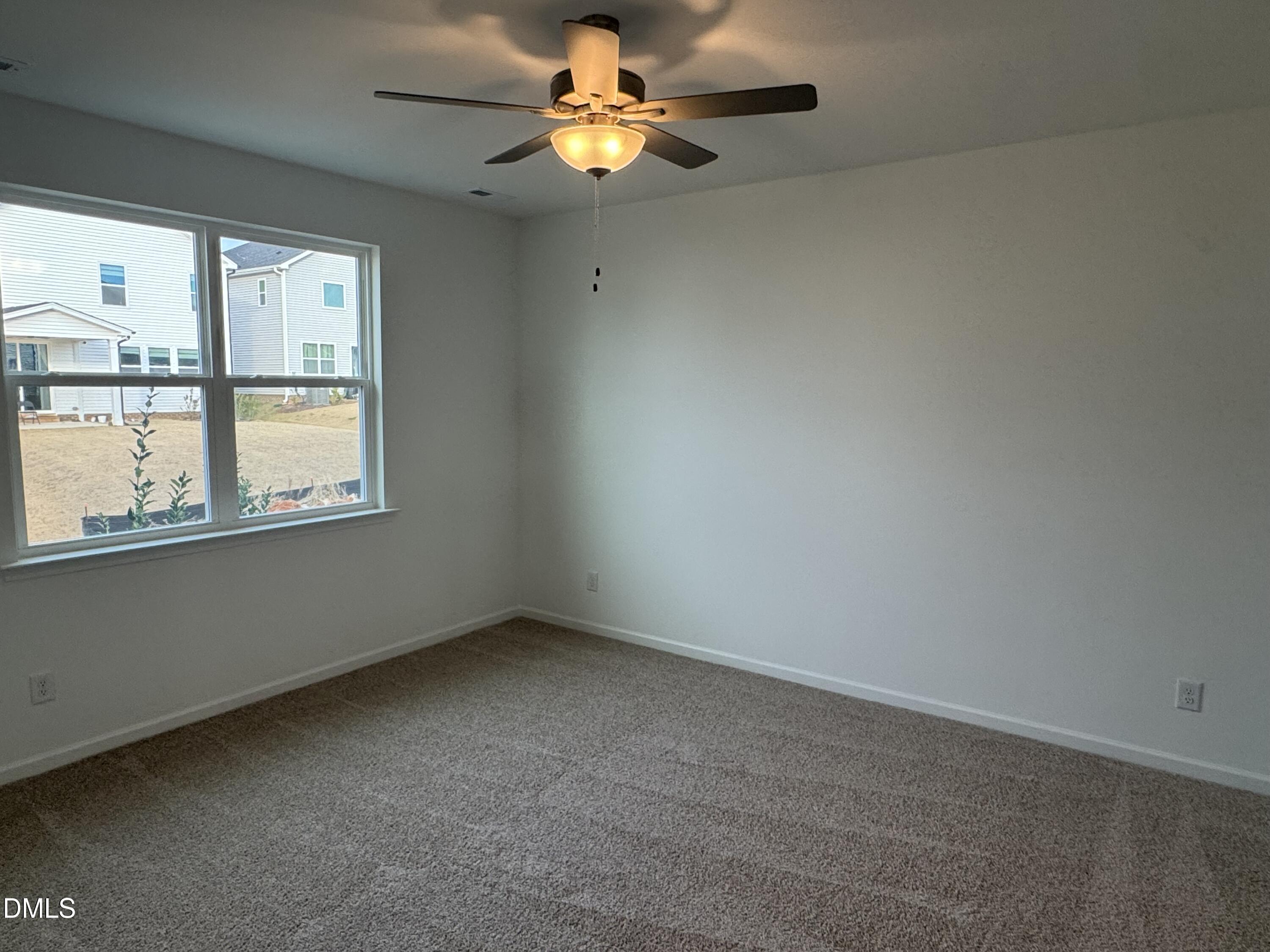 128 Vulcan Street Garner, NC 27529 - Photo 13 of 28 a view of an empty room with a window