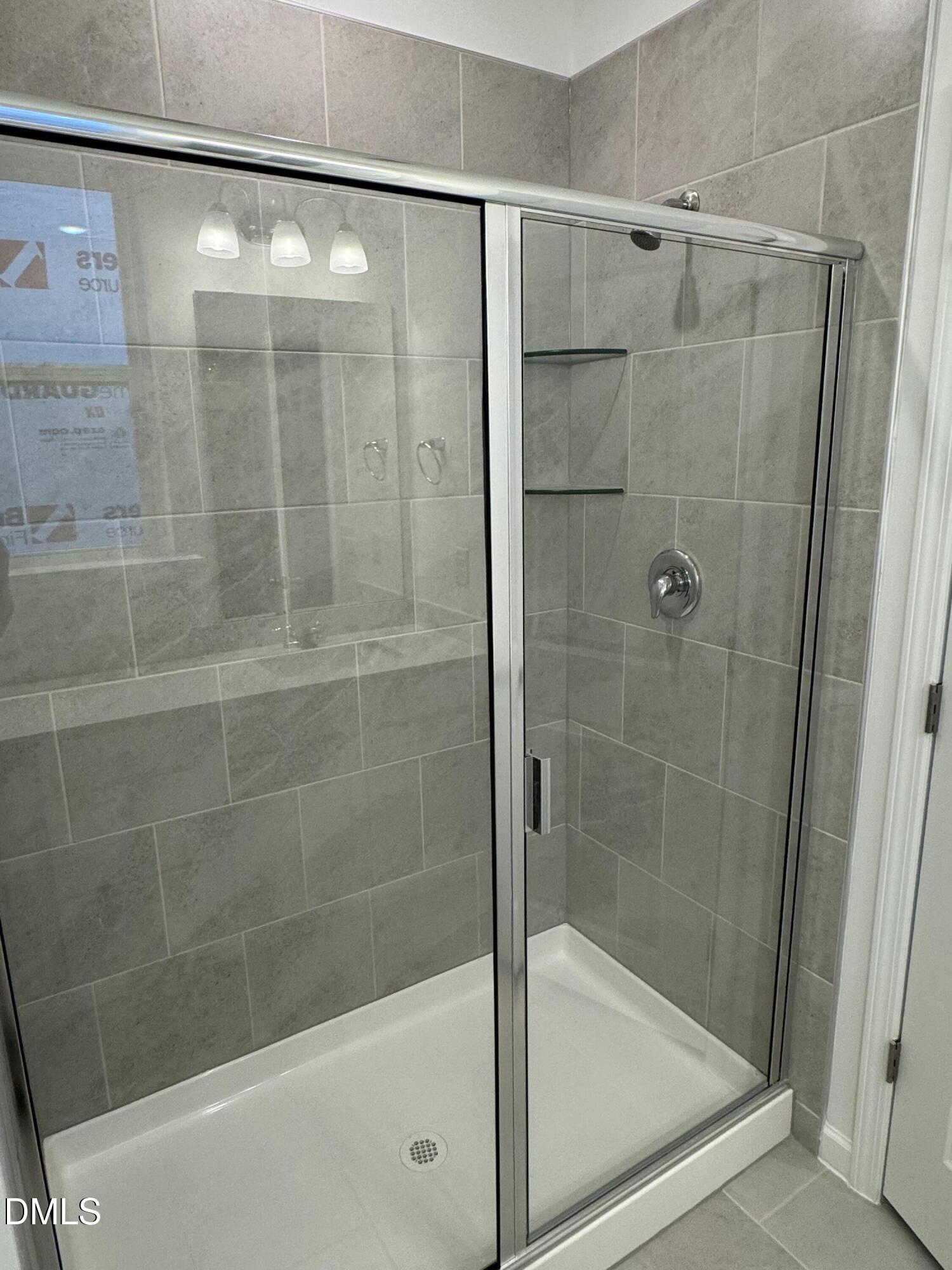 128 Vulcan Street Garner, NC 27529 - Photo 15 of 28 a bathroom with a shower and bathtub