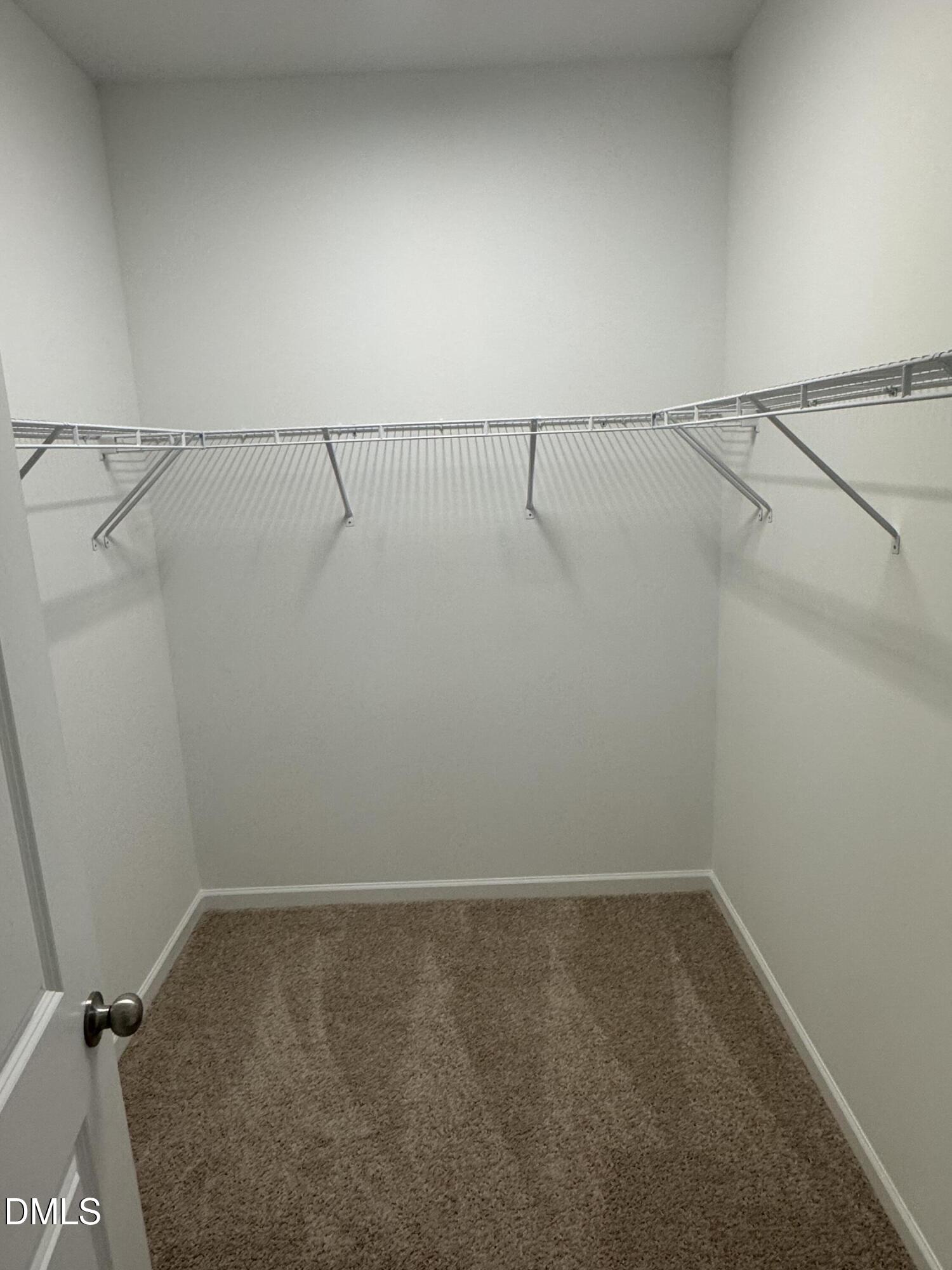 128 Vulcan Street Garner, NC 27529 - Photo 16 of 28 a view of a room with racks on the wall