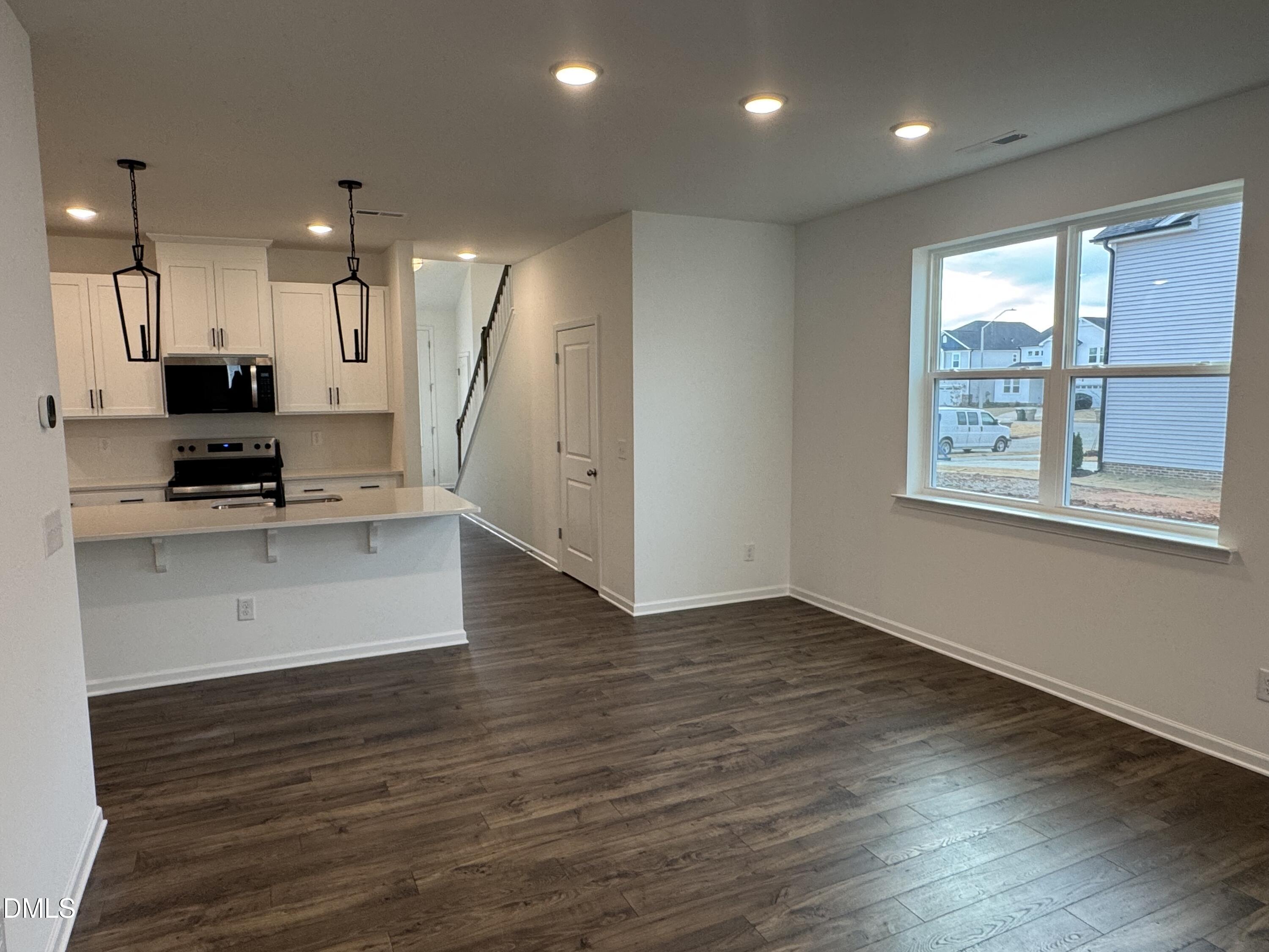 128 Vulcan Street Garner, NC 27529 - Photo 17 of 28 a view of a kitchen with a sink and a stove