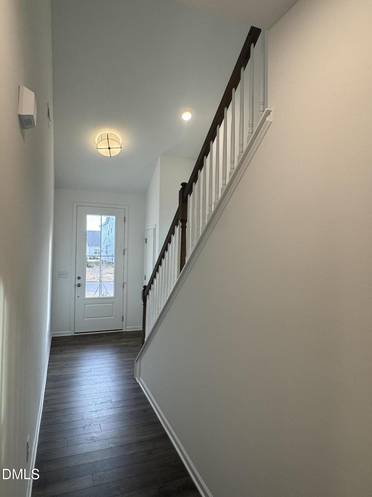 128 Vulcan Street Garner, NC 27529 - Photo 18 of 28 a view of entryway with wooden floor