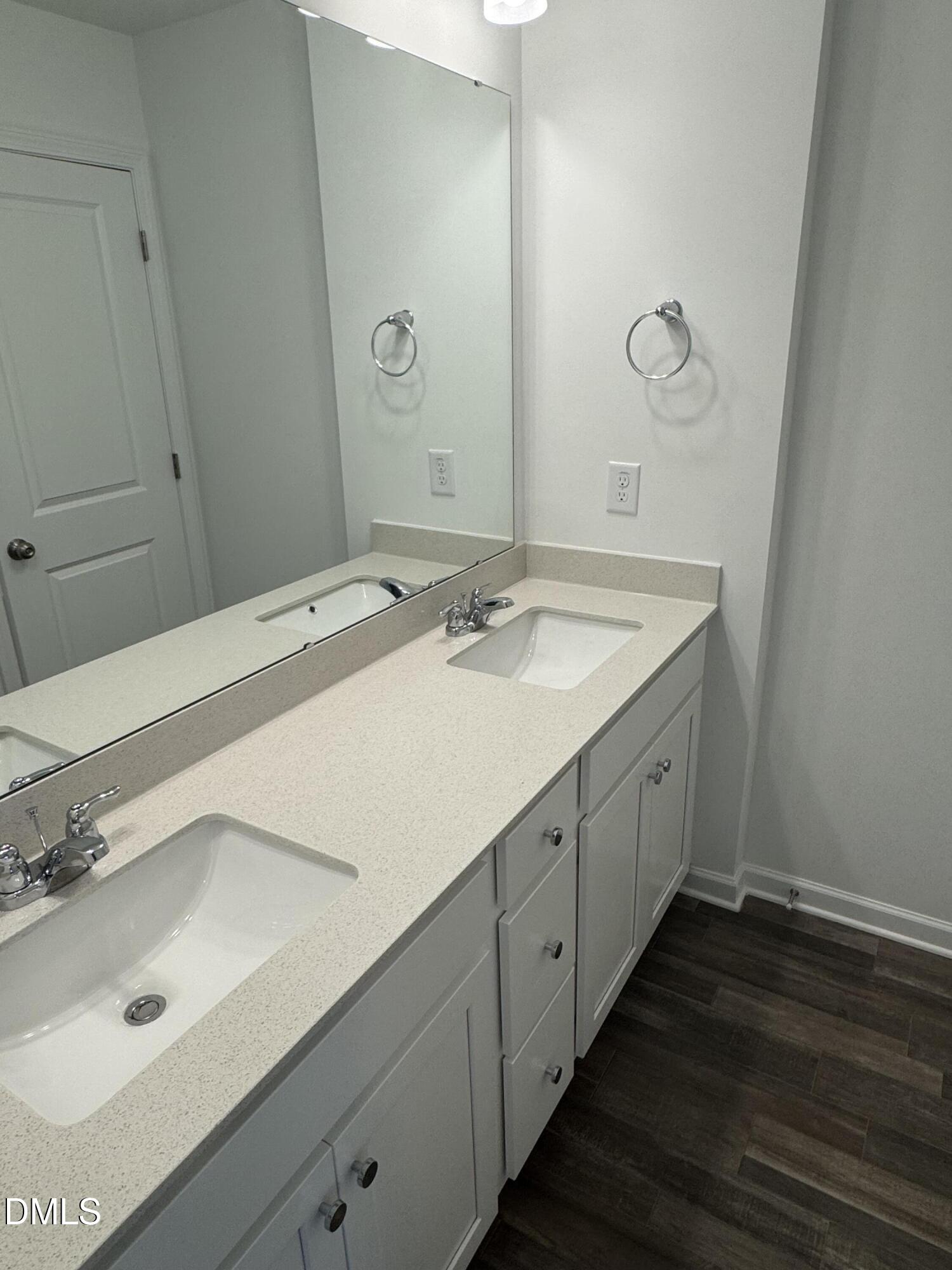 128 Vulcan Street Garner, NC 27529 - Photo 20 of 28 a bathroom with a sink and a mirror