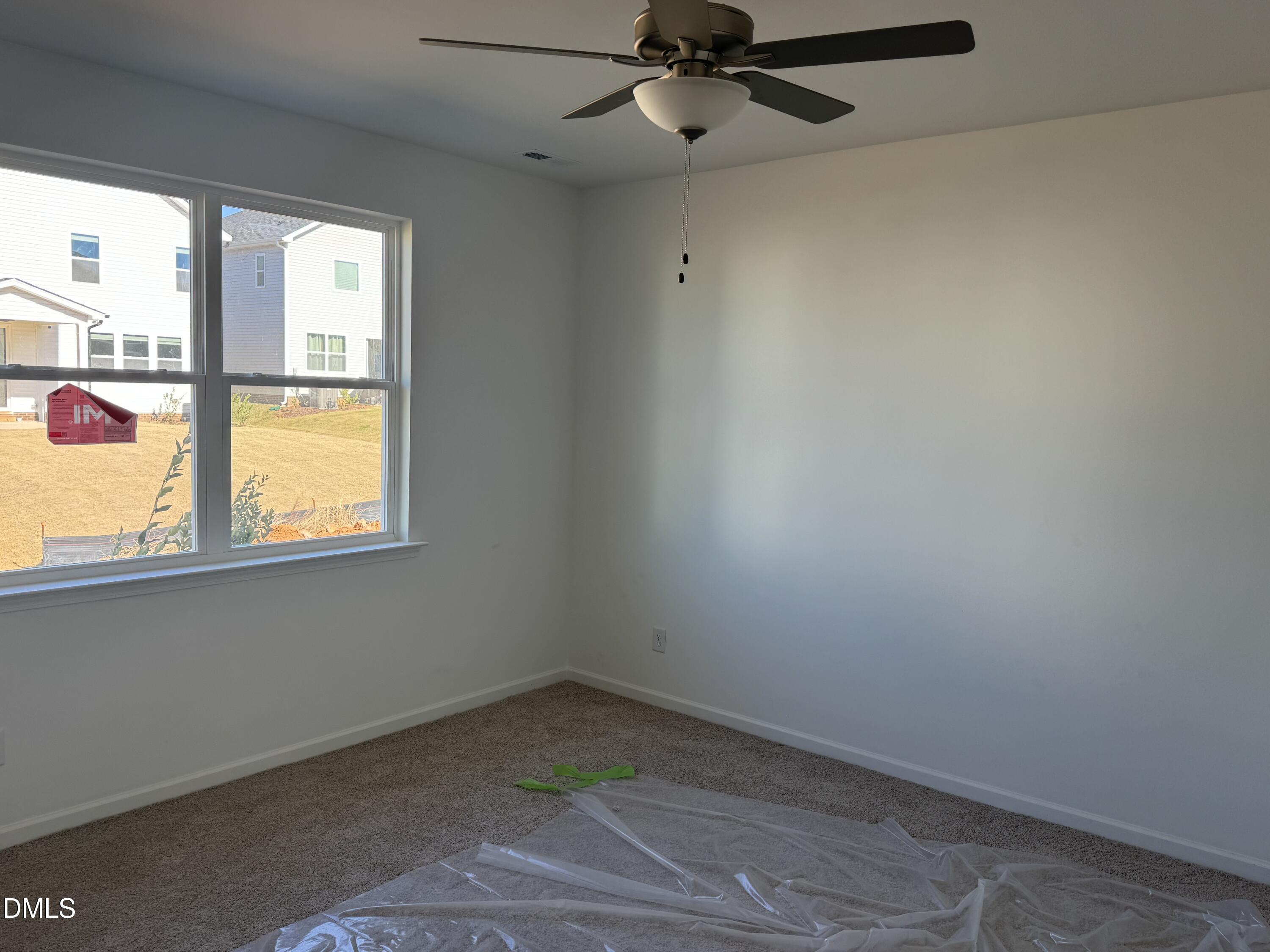 128 Vulcan Street Garner, NC 27529 - Photo 4 of 28 en empty room with a window