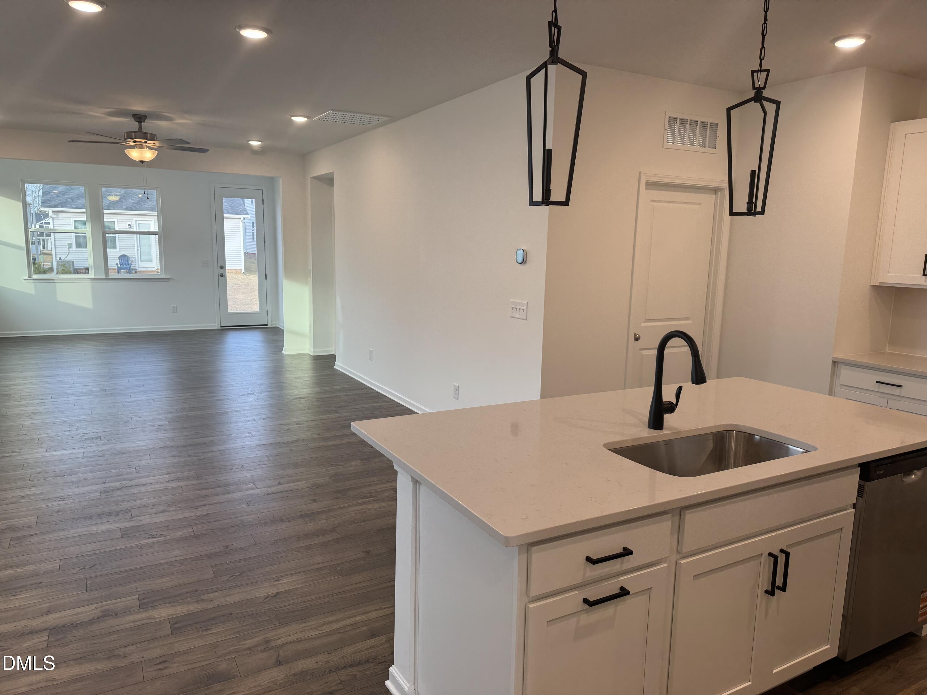 128 Vulcan Street Garner, NC 27529 - Photo 5 of 28 a kitchen with sink and mirror