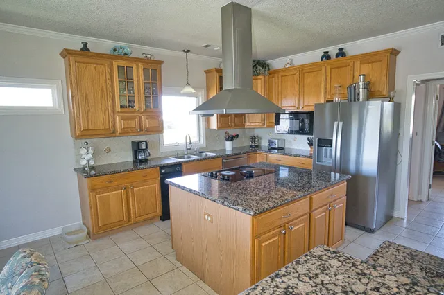 a bedroom with bed and wooden floor
