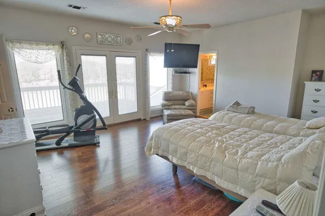 a swimming pool with outdoor seating and lake