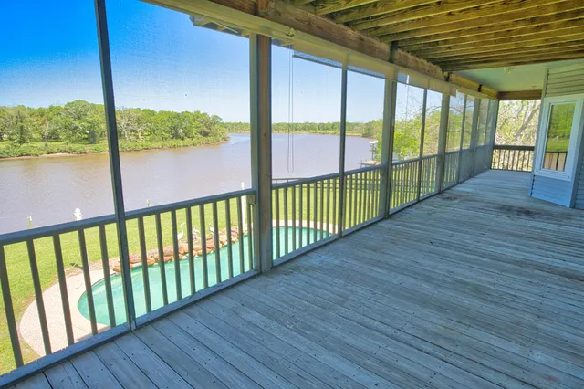 a view of balcony with wooden floor