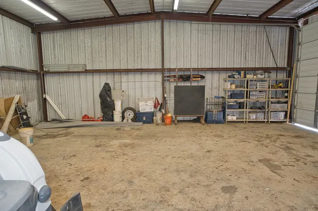 a view of a dining room with furniture and a chandelier