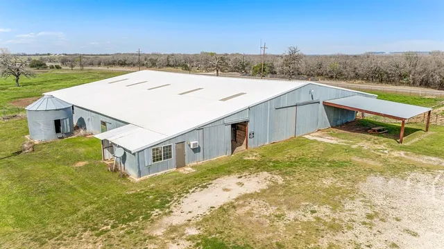 a aerial view of a house with a yard
