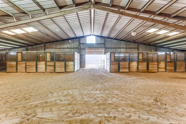 a view of a room with wooden ceiling