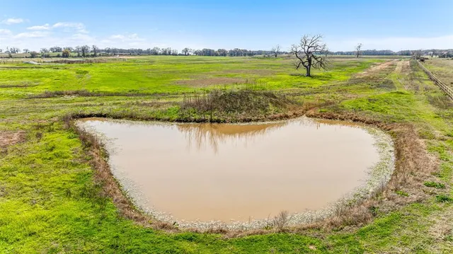 a view of a swimming pool with an ocean view