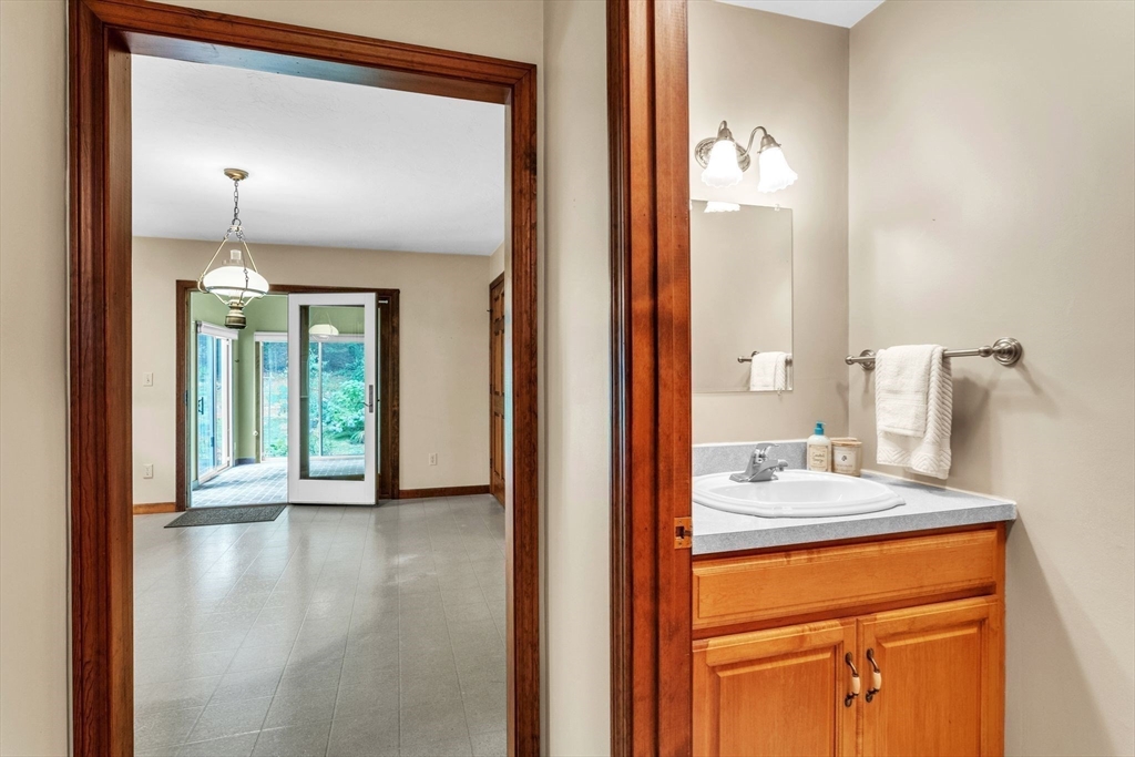 17 Church Road Huntington, MA 01050 - Photo 15 of 36 a view of bathroom with a sink and a mirror