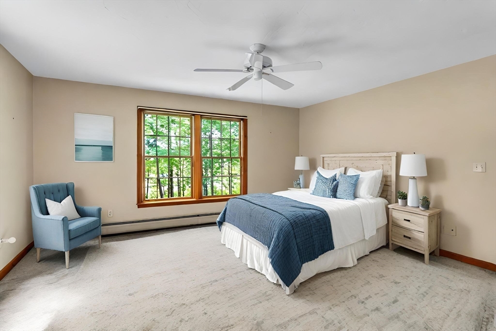 17 Church Road Huntington, MA 01050 - Photo 16 of 36 a spacious bedroom with a bed and a couch