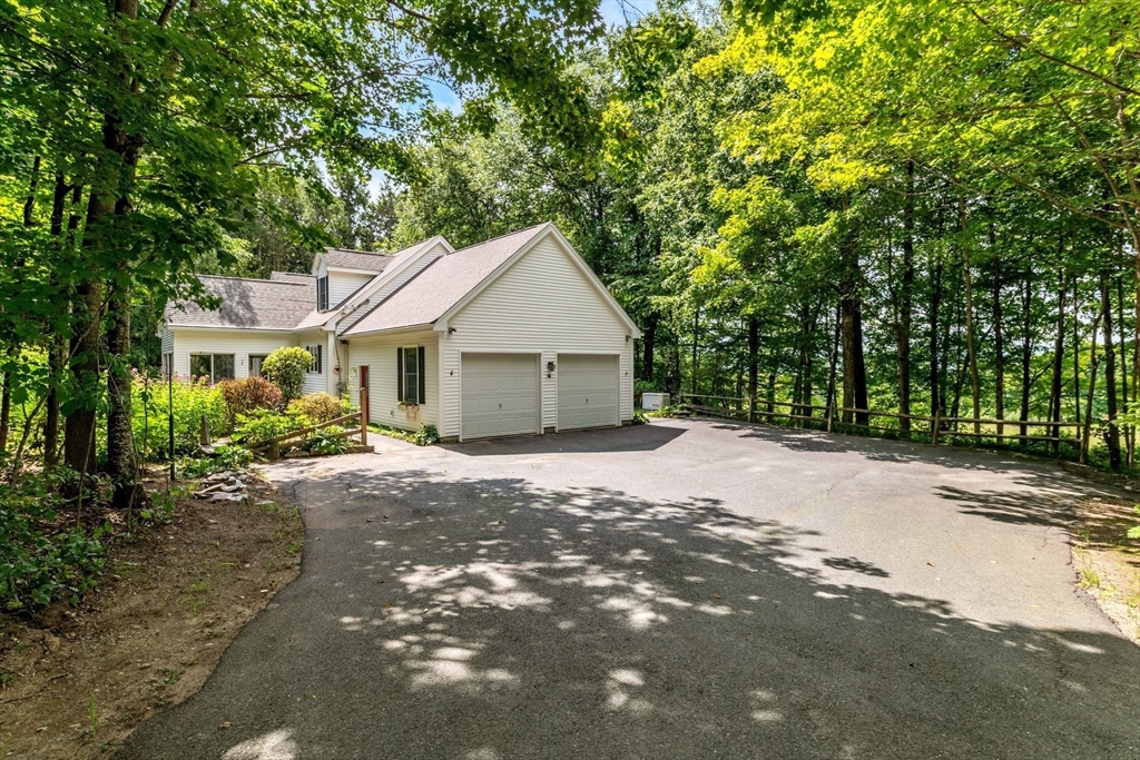17 Church Road Huntington, MA 01050 - Photo 2 of 36 a front view of a house with a garden