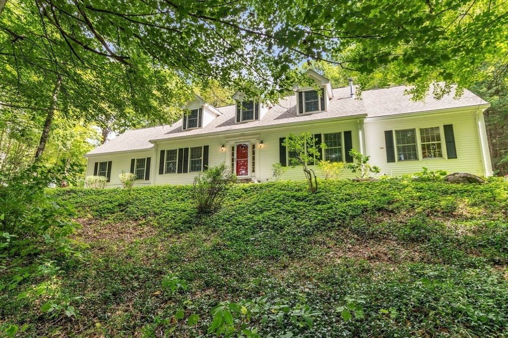 17 Church Road Huntington, MA 01050 - Photo 3 of 36 a front view of a house with a garden