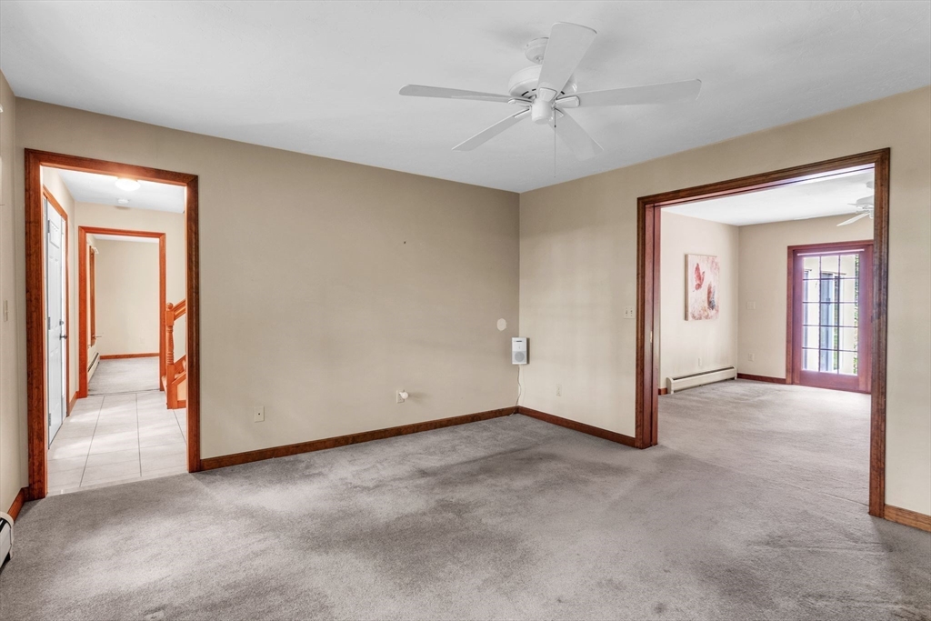 17 Church Road Huntington, MA 01050 - Photo 6 of 36 an empty room with fan and windows