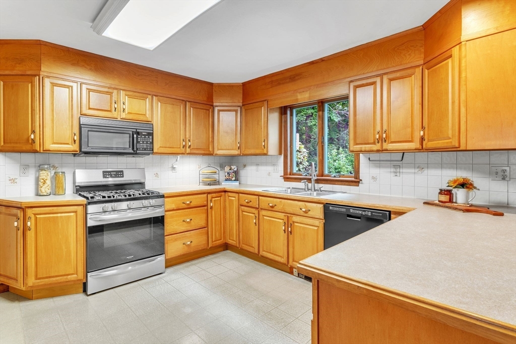 17 Church Road Huntington, MA 01050 - Photo 9 of 36 a kitchen with stainless steel appliances granite countertop a stove sink and cabinets