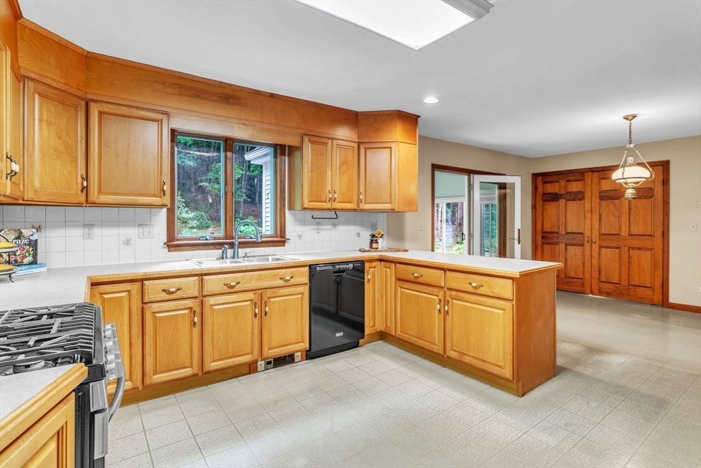 17 Church Road Huntington, MA 01050 - Photo 10 of 36 a kitchen with stainless steel appliances granite countertop a stove a sink and a refrigerator