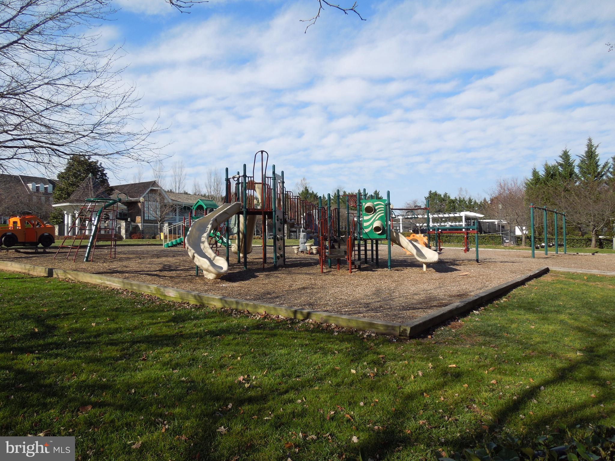 304 Ridgepoint Place, Unit 14 Gaithersburg, MD 20878 - Photo 20 of 25 a view of a park with swings and slides